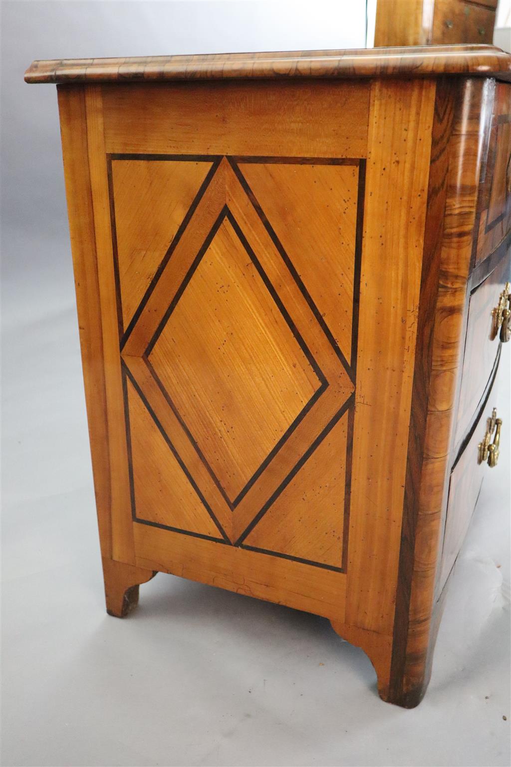 A French Regence olivewood and rosewood bowfront commode, c.1725, W.2ft 8in. D.1ft 9in. H.2ft 6in.